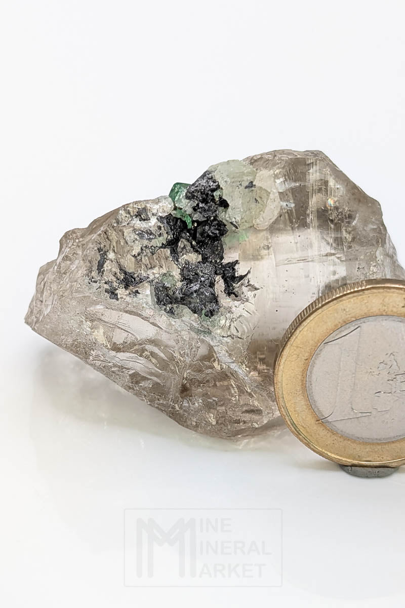 Tsavorite on rock crystal