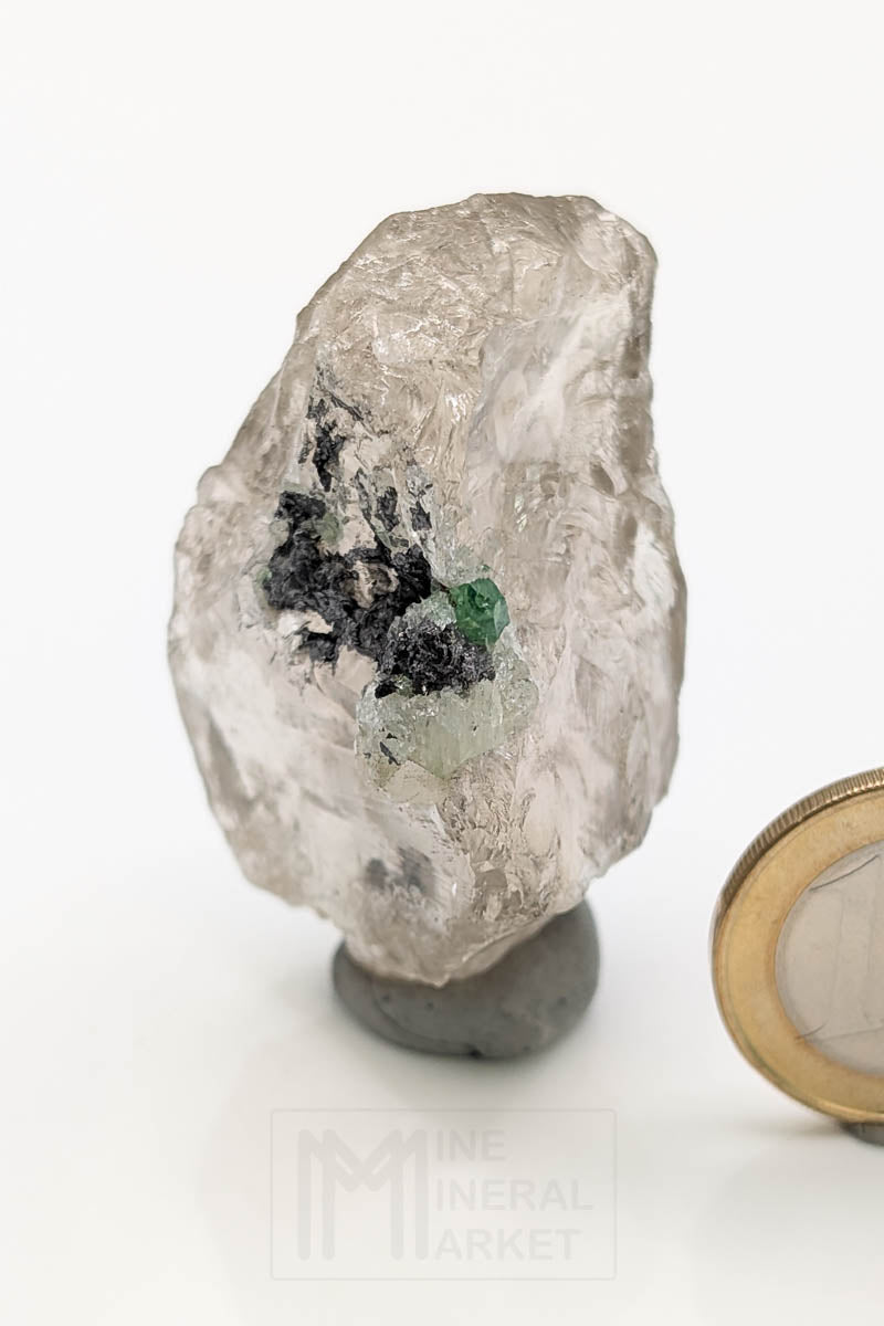 Tsavorite on rock crystal