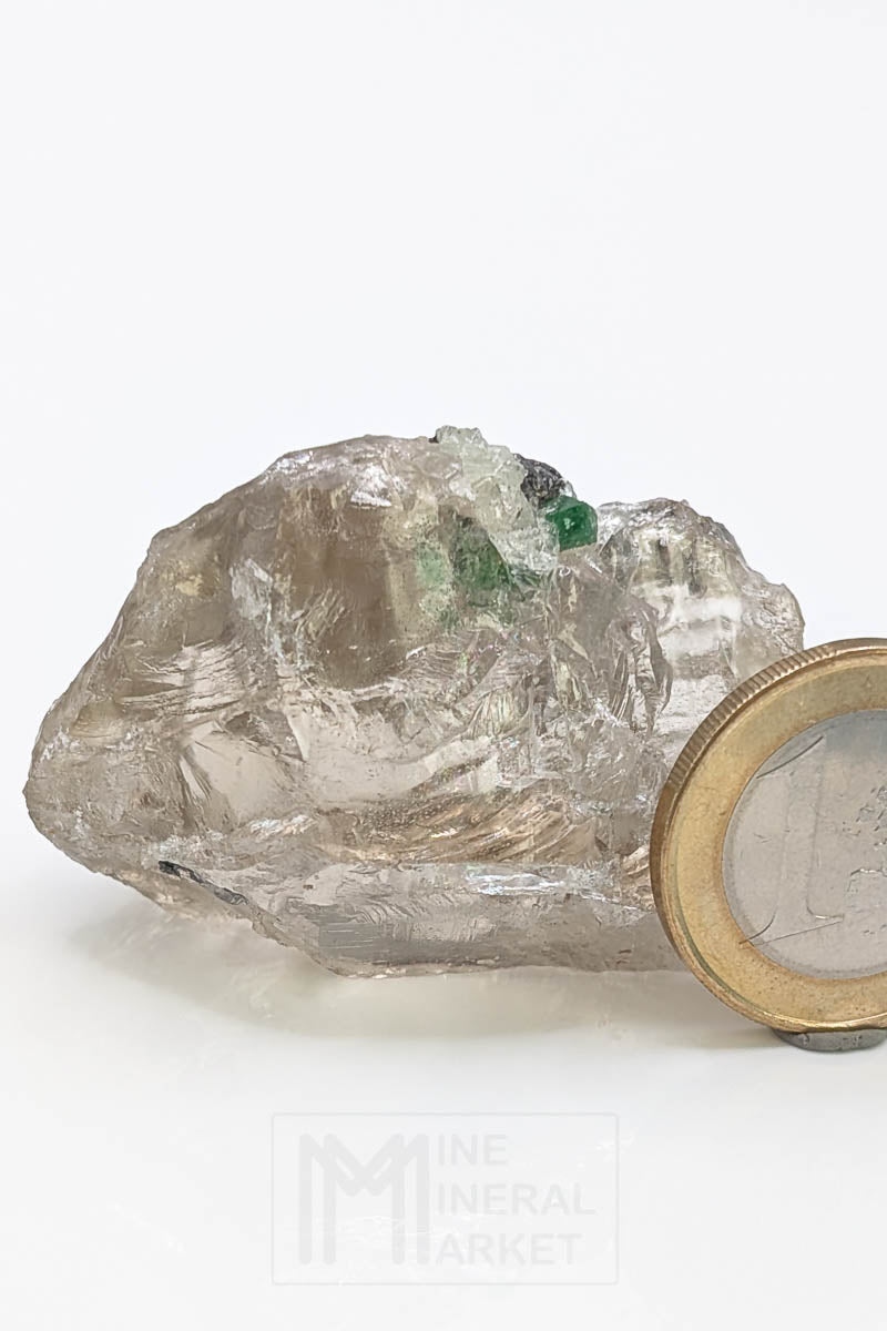 Tsavorite on rock crystal